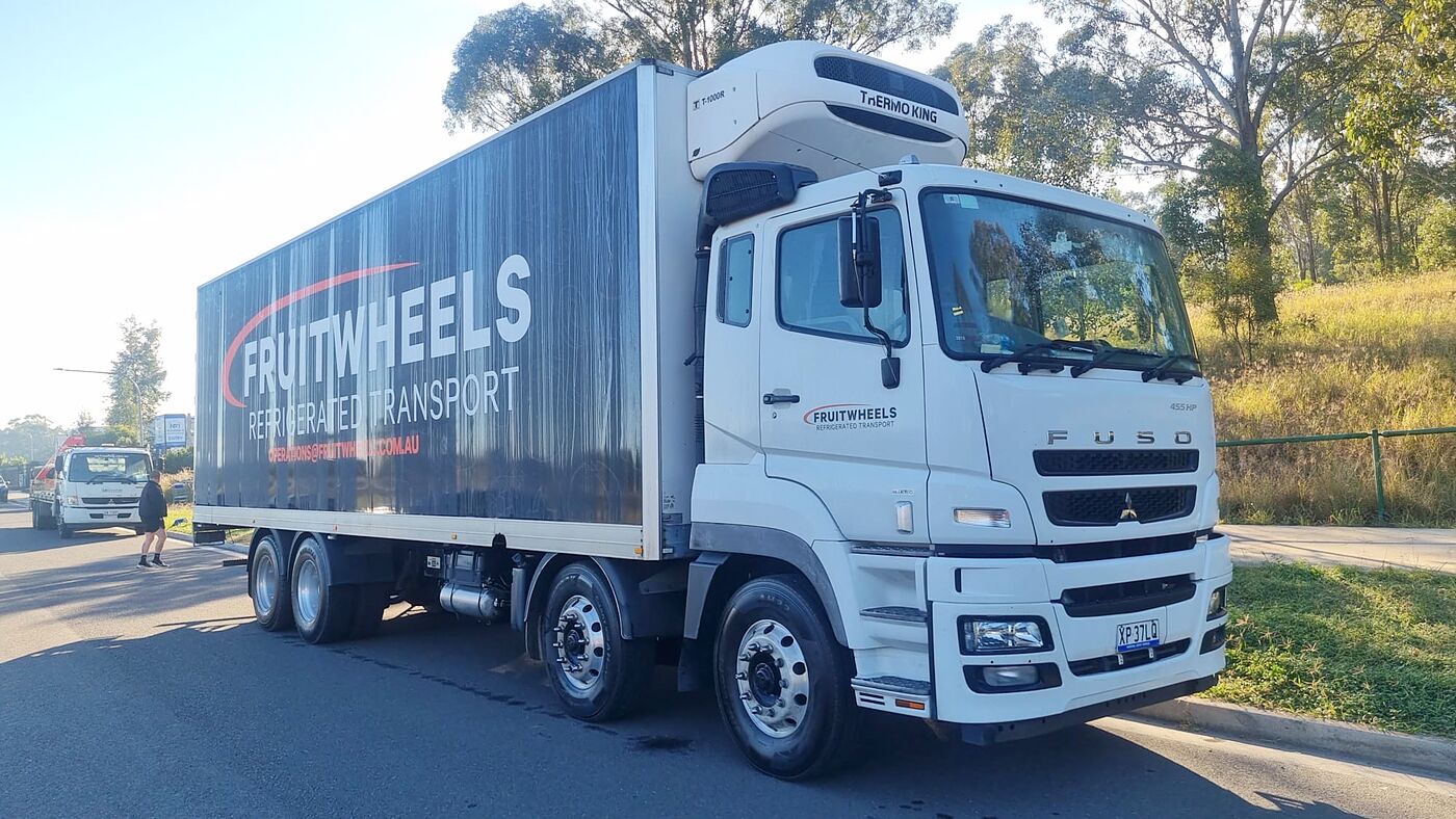 A Fruit Wheels truck at the Sydney Markets docks at night